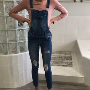 Super cute overalls with rips on legs